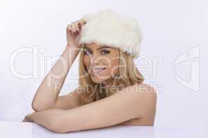 beautiful woman in a white winter cap