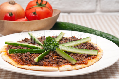 turkish beef pizza with cucumber on top