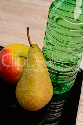 fresh fruits and a bottle of water