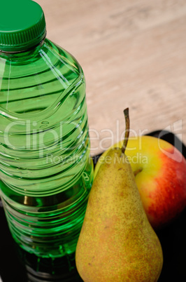 fresh fruits and a bottle of water