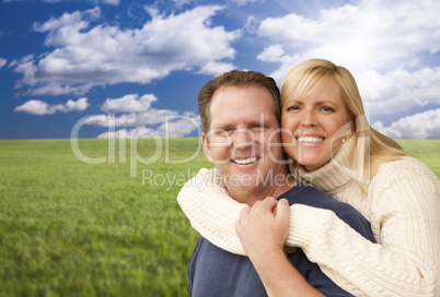 happy attractive couple hugging at the park