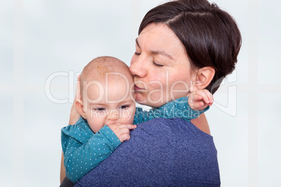 mother holding her baby in her arms