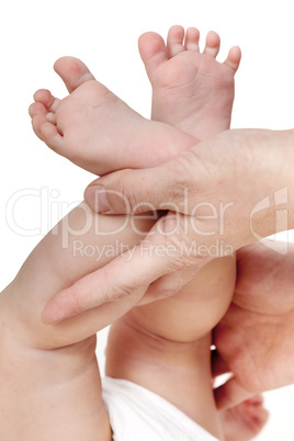 mother hands holding baby feet