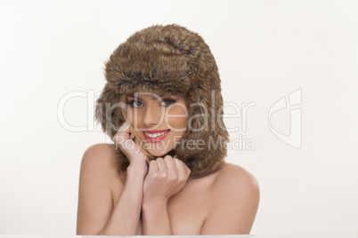 beautiful coquette in a furry winter hat