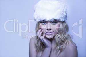 beautiful bare shouldered woman in a winter hat