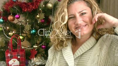 Portrait of a smiling woman and christmas tree