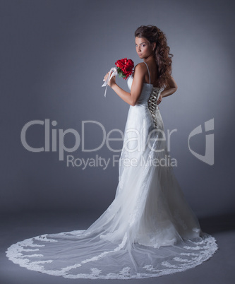 Image of charming bride posing in elegant dress