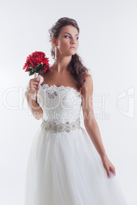 Portrait of concentrated bride posing in studio