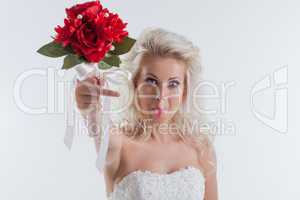 Portrait of funny young bride posing in studio