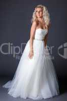 Romantic model posing in fashionable wedding dress