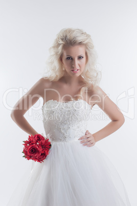 Beautiful fashionable bride posing with bouquet