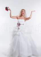 Cheerful model posing in elegant wedding dress