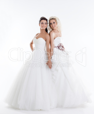 Image of beautiful shapely brides holding hands
