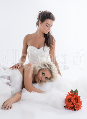 Image of lovely brides in luxury wedding dresses