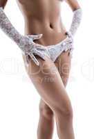 Slim woman's body in lacy panties and gloves