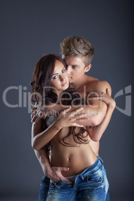 Portrait of passionate lovers posing in studio