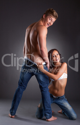 Playful young partners posing in studio