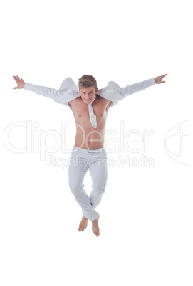 Handsome stylish man jumping isolated on white