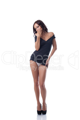 Seductive slim model posing in black tunic