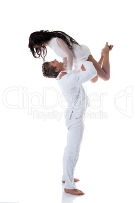 Image of emotional young couple dancing in studio