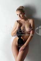 Hot slim blonde posing naked in studio