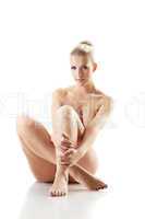 Exciting sensual blonde posing naked in studio