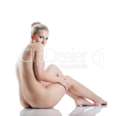 Shy pretty nude girl posing back to camera