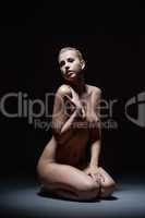 Sexual nude model posing in studio