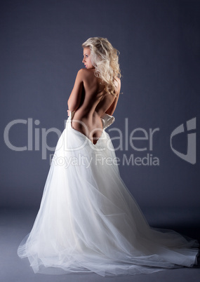 Seductive topless bride posing back to camera