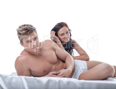 Image of pretty young couple posing in bed
