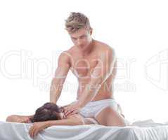 Attractive muscular guy massaging girl's back