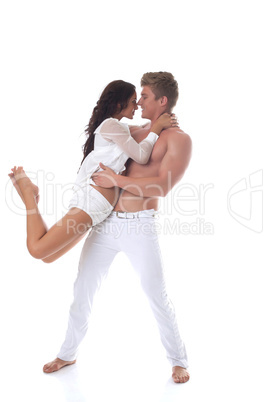 Beautiful smiling couple dancing in studio