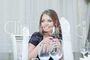 Beautiful young woman smiling in restaurant