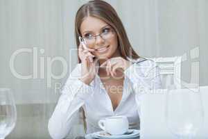 Beautiful business woman talking on mobile phone