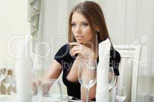 Image of seductive woman posing in restaurant