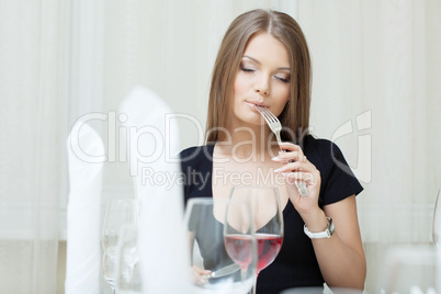 Portrait of beautiful girl posing in restaurant