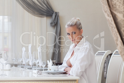 Attentive beautiful girl posing in restaurant