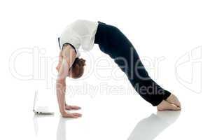 Business lady doing gymnastics and posing with PC