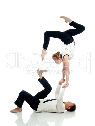 Businessmen doing yoga with PC, isolated on white