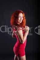 Exciting red-haired woman looking at camera
