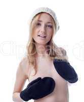 Smiling topless girl posing with mittens and hat