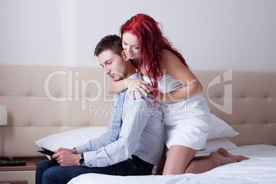 Playful attractive woman flirting with young man