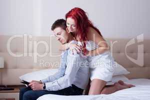 Playful attractive woman flirting with young man