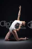 Emotional slim ballet performer posing in studio