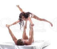 Cheerful young lovers playing in bed, close-up