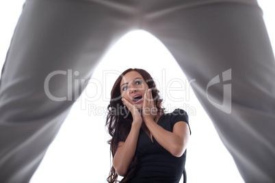 Image of surprised young brunette posing in studio