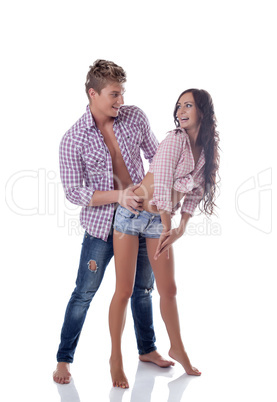 Playful young couple smiling at each other