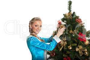 Beautiful Snow Maiden decorating Christmas tree
