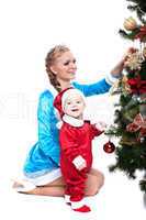 Smiling mother and baby posing in Xmas costumes