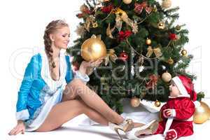 Happy mom and kid posing in Christmas costumes